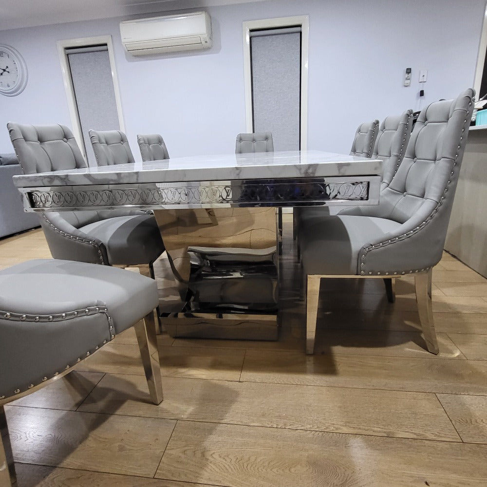 Best Marble Dining Table with 8 Chairs Elegant and Classy LV Marble Dining Table With Modern Grey Leather Dining Room Chairs with Silver Stainless Steel Frame.