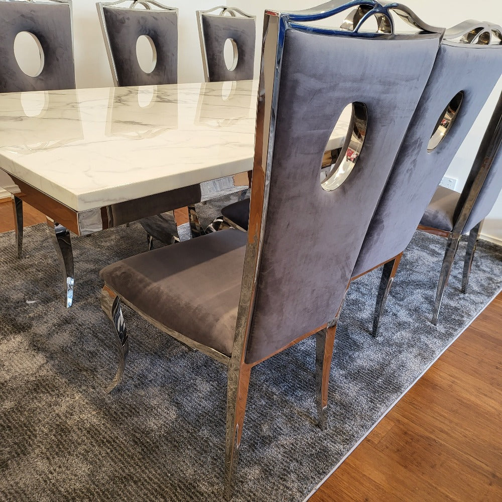 Best Marble Dining Table set. Classy Marble Dining Table With Circle Grey Velvet Style Dining Room Chairs in Silver Stainless Steel Frame