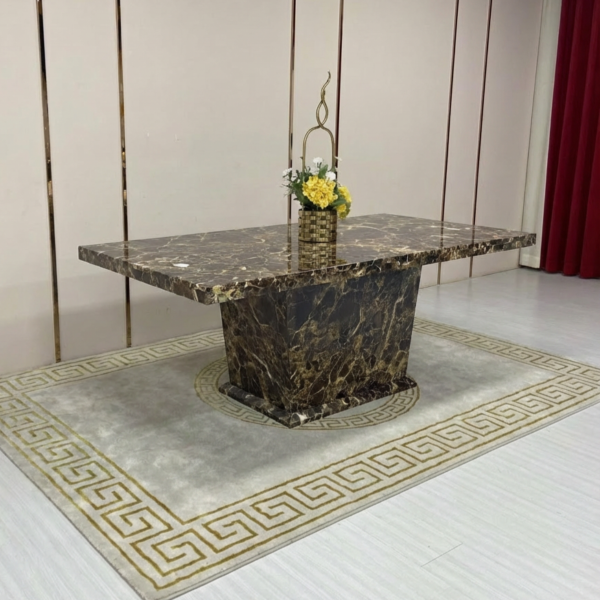 Marble-patterned table with a vase of yellow flowers on a decorative rug.