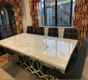 Luxurious and Stylish Elegant Marble Dining table with Gold Modern Black Velvet Dining Room Chairs in Silver Stainless Steel Frame.