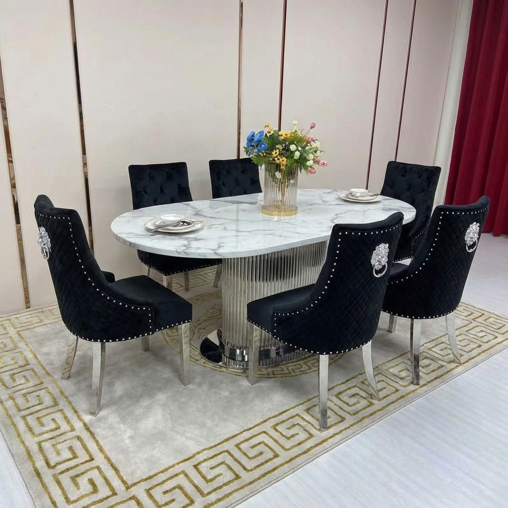 Dining room setup with a round marble table and black chairs on a patterned rug.