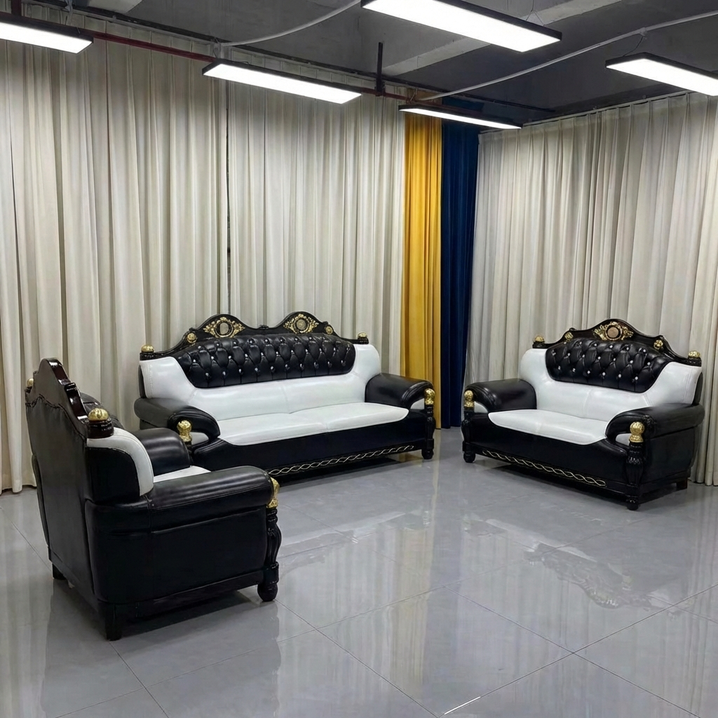Luxury black and white leather sofa set in a showroom with curtains and lights.