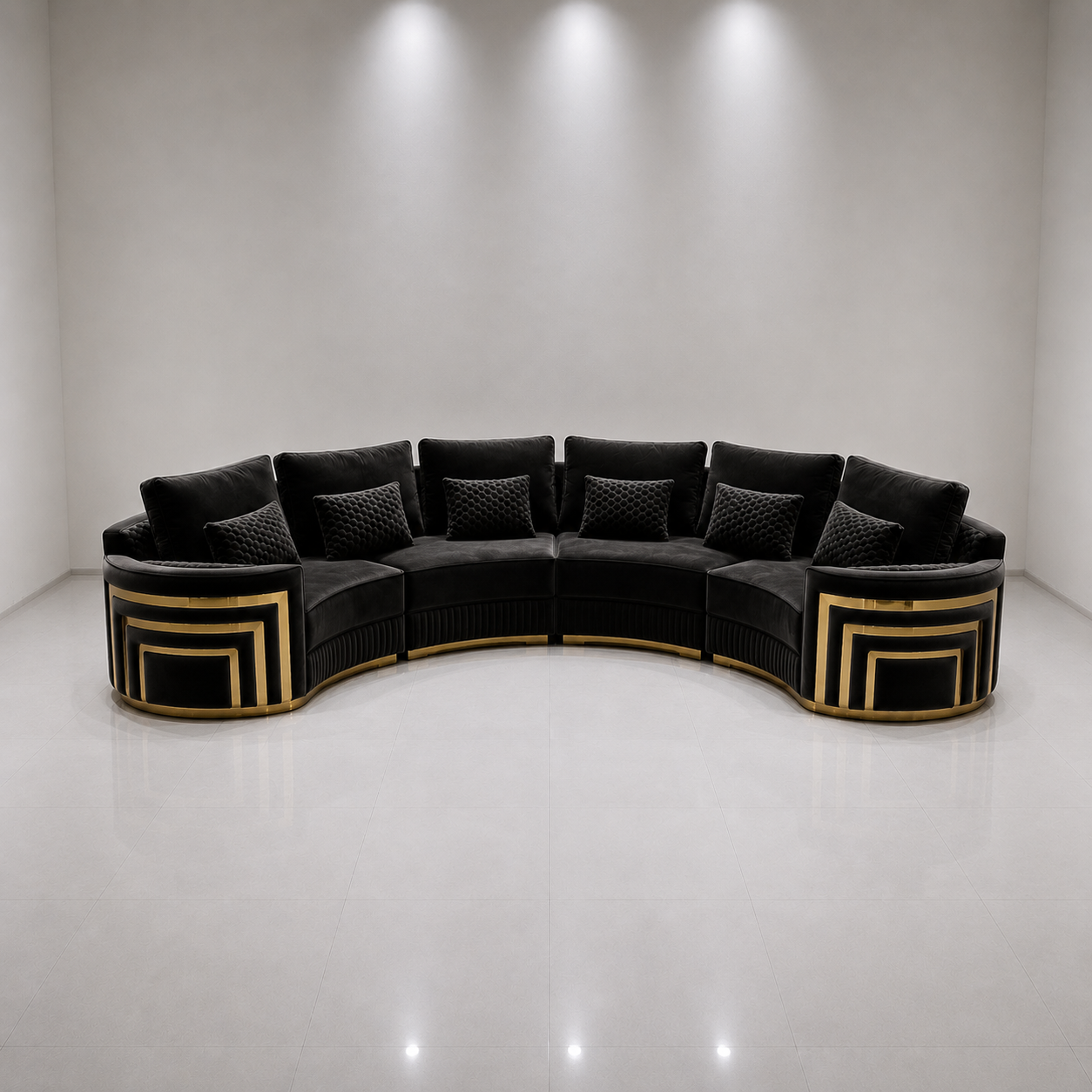 A curved modular sectional sofa upholstered in black velvet with geometric gold metal trim and matching accent pillows, set against a minimalist white studio background.