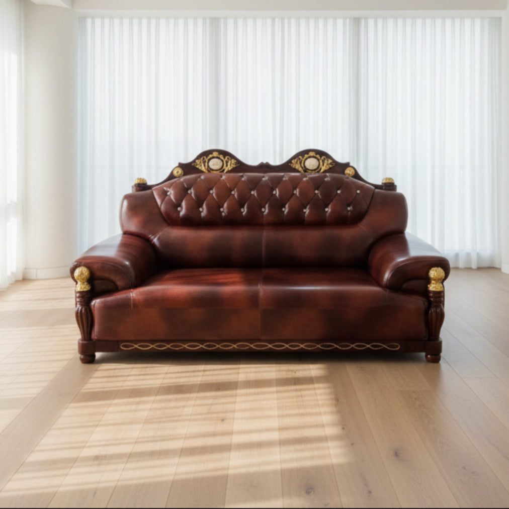 Brown leather sofa with decorative elements on a tiled floor.