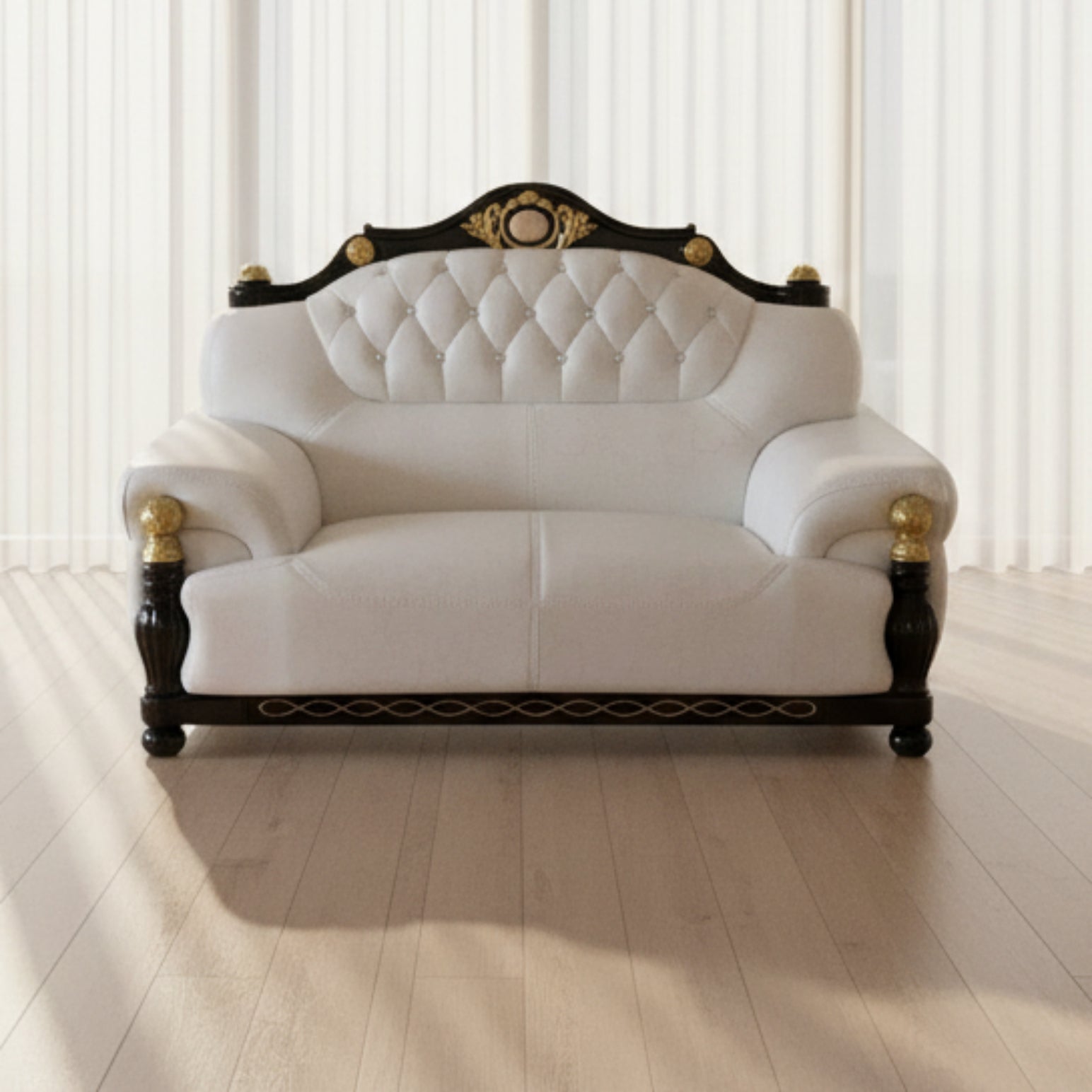 White leather sofa with black wooden frame and gold accents on a tiled floor.