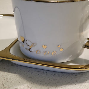 Golden Trim Modern Love Style Tea Cup, a Saucer and Gold Spoon in White