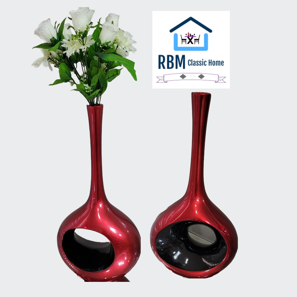 The perfect finishing touch to your home decor is the red stylish and modern exquisite right-sized ceramic sculptures with a black hole