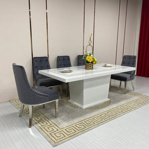 Classy Marble Dining Table With Grey Velvet Dining Room Chairs in Silver Stainless Steel Frame