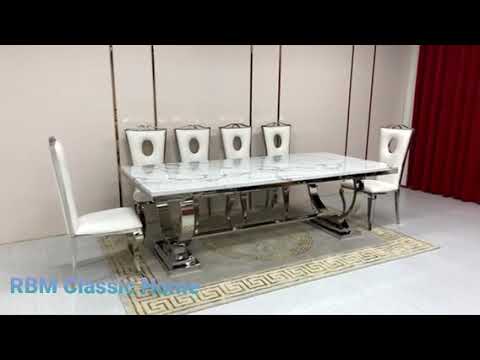 Classic Marble Dining Table With Circle White Leather Dining Room Chairs in Silver Stainless Steel Frame
