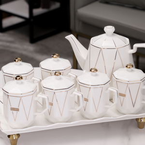 Stylish Ceramic Tea Pot, Tea Cup and Serving Tray in White with Golden Trims on All