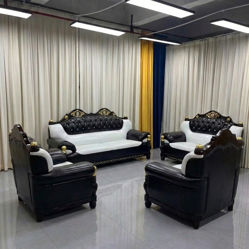 Luxury black and white leather sofa set in a showroom setting with curtains.
