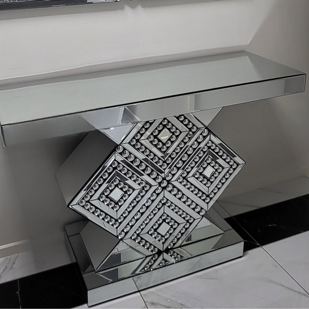 Decorative glass table with geometric design on a reflective surface