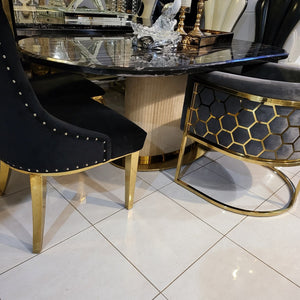 Oval Shaped Classy Luxurious and Stylish Elegant Marble Dining table with Gold Modern Black Velvet Dining Room Chairs in Gold Stainless Steel Frame