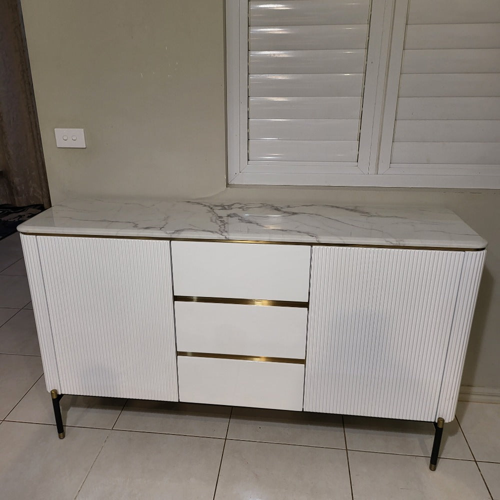 White MDF Buffet Cabinet is Timeless, Versatile and Stylish with Gold Stainless Steel Frame, Two Shelves and Three Drawers.
