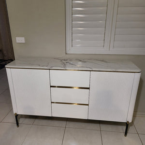 White MDF Buffet Cabinet is Timeless, Versatile and Stylish with Gold Stainless Steel Frame, Two Shelves and Three Drawers.
