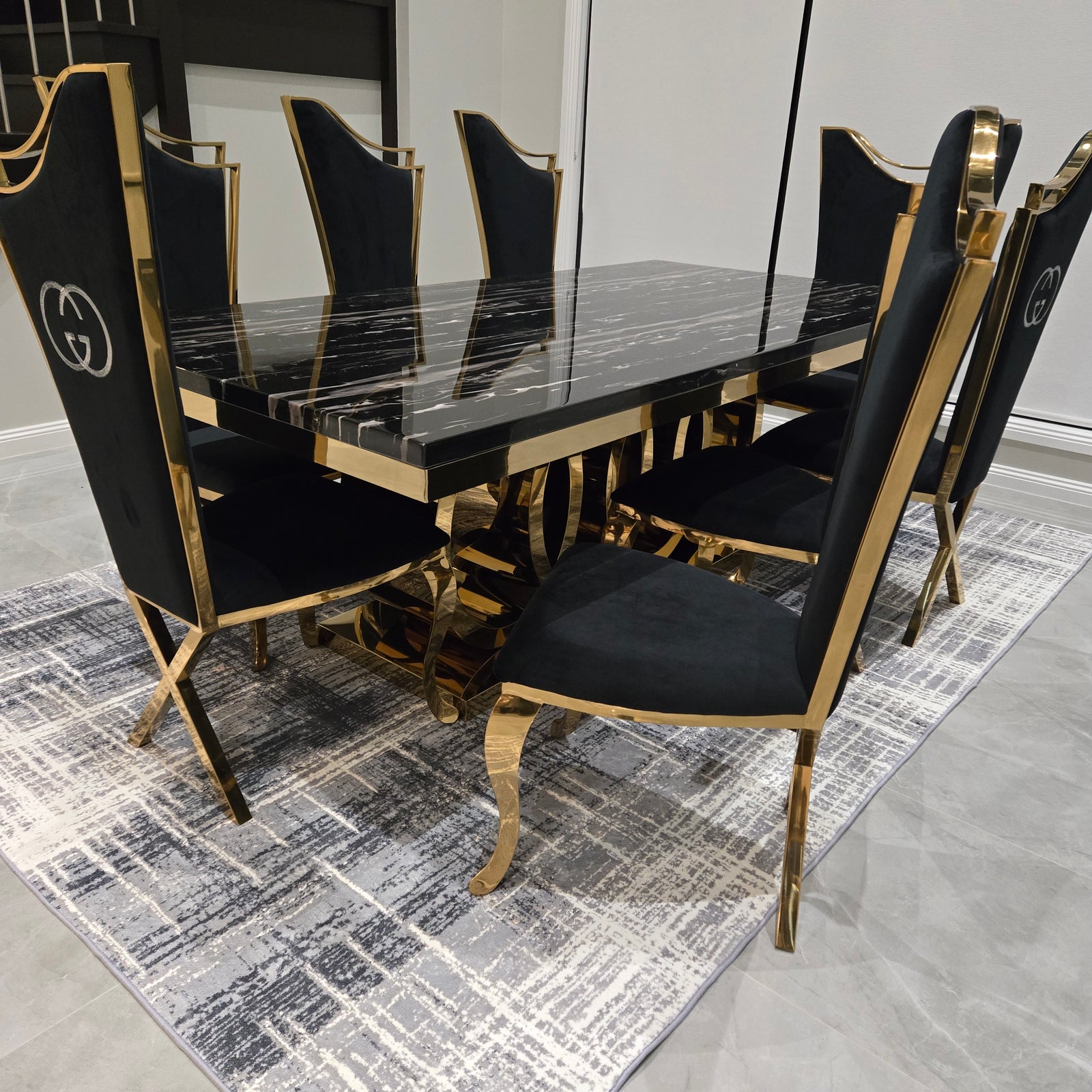 Black and gold director's chair on a patterned floor
