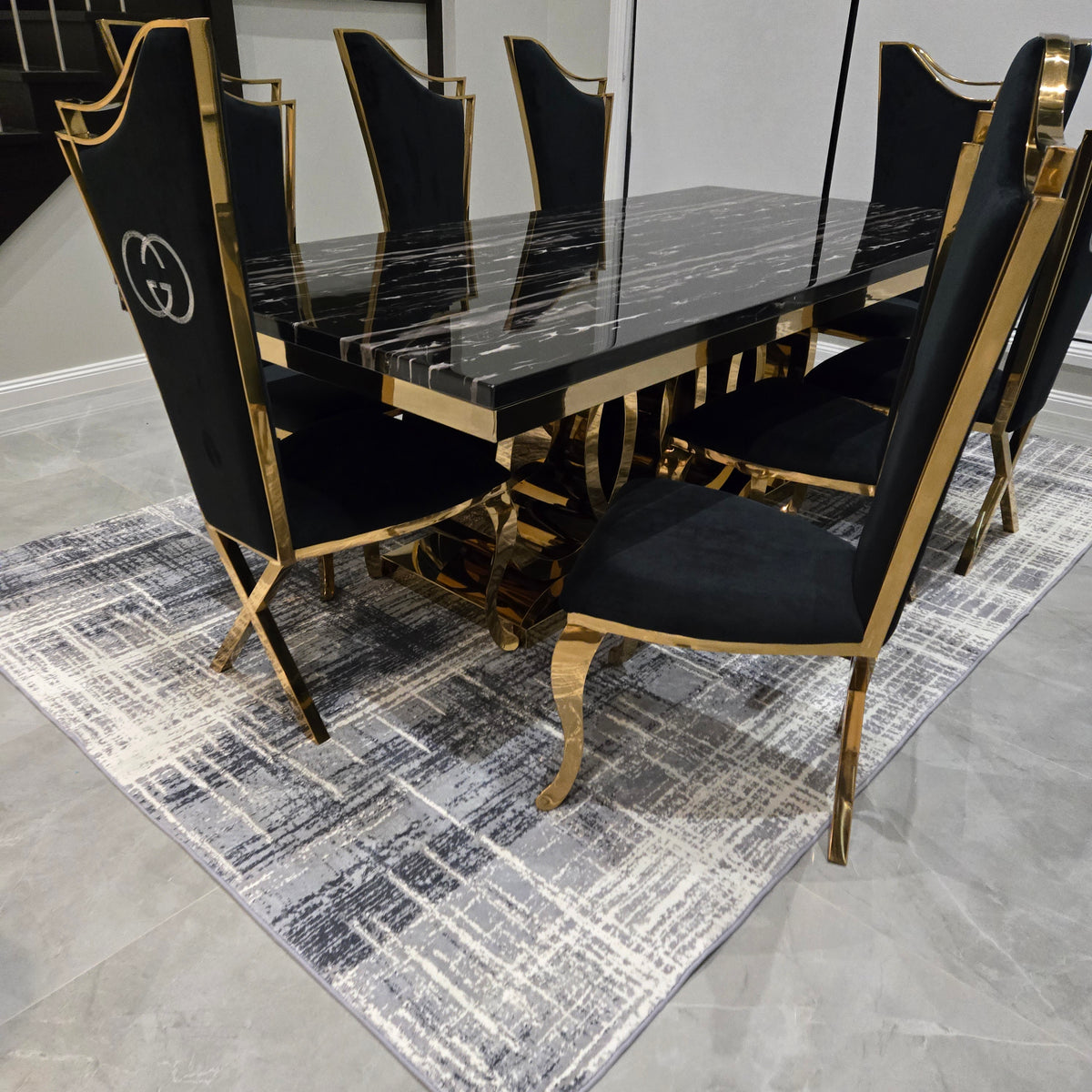Black and gold chair on a textured gray rug