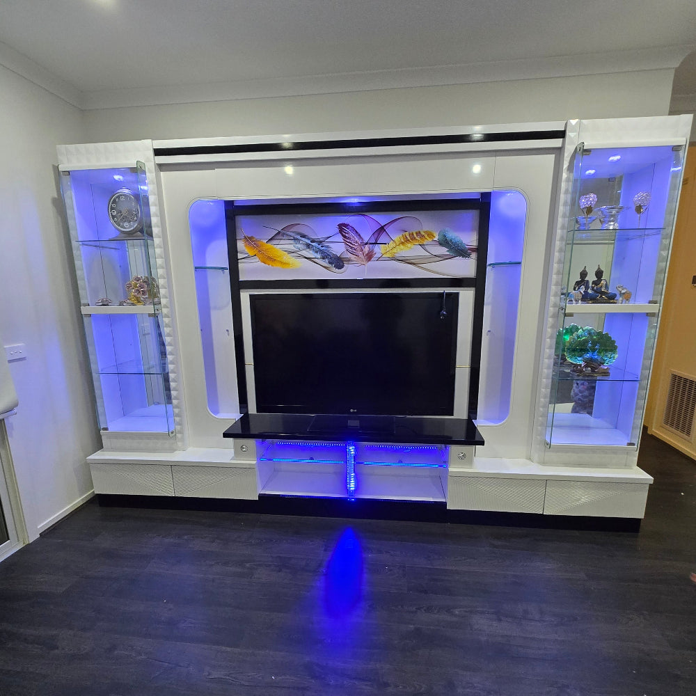 Modern entertainment console with LED lighting in a room setting