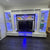 Modern entertainment console with LED lighting in a room setting