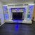 Modern entertainment console with LED lighting in a room.