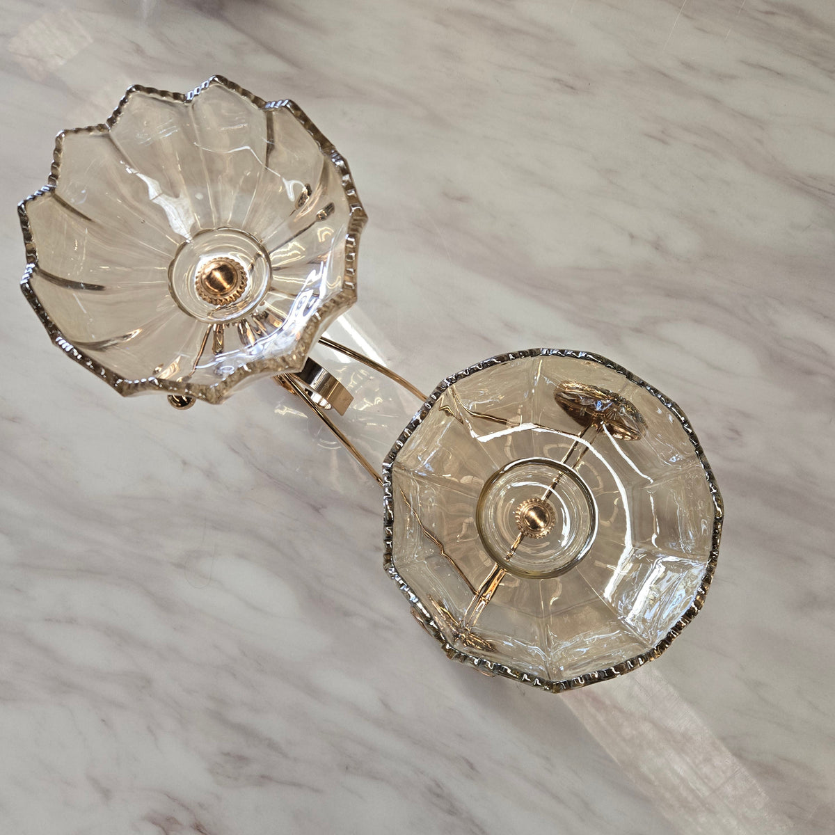 Pair of crystal earrings on a marble surface
