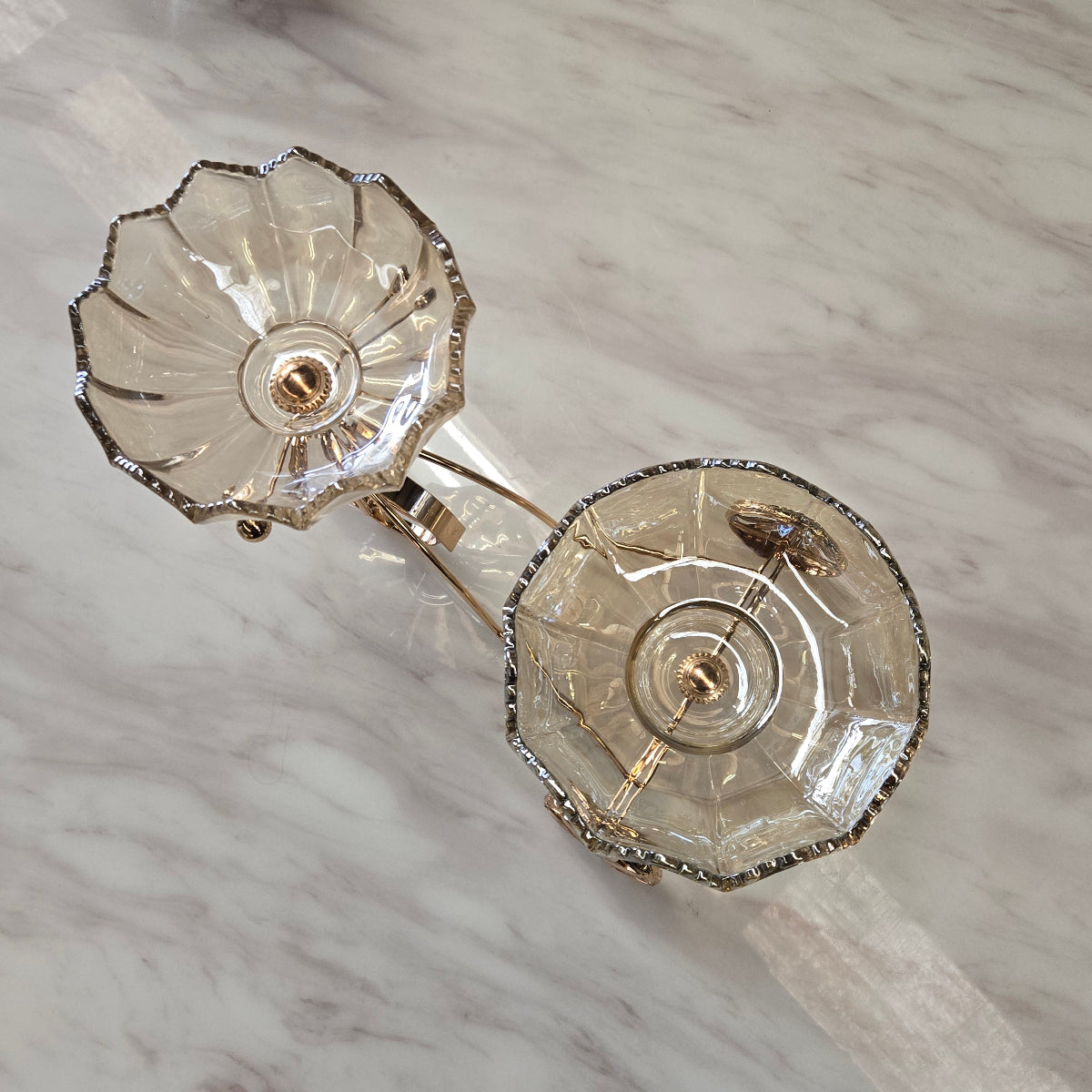 Pair of crystal bowls on a marble surface