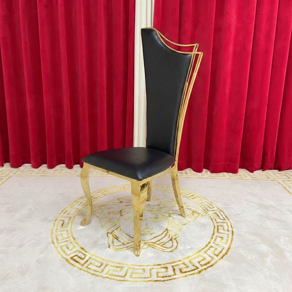 Black chair with gold frame on a decorative rug in front of red curtains