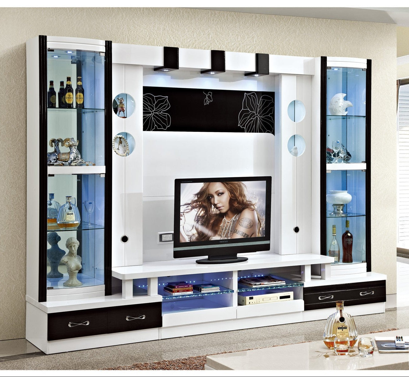 Modern entertainment center with TV and shelves in a living room setting
