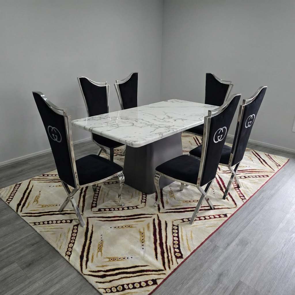 Dining room with marble table and black chairs on a patterned rug
