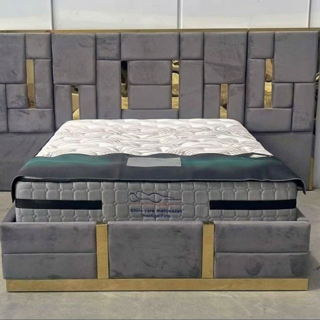 Gray upholstered bed with a matching headboard in a room setting.