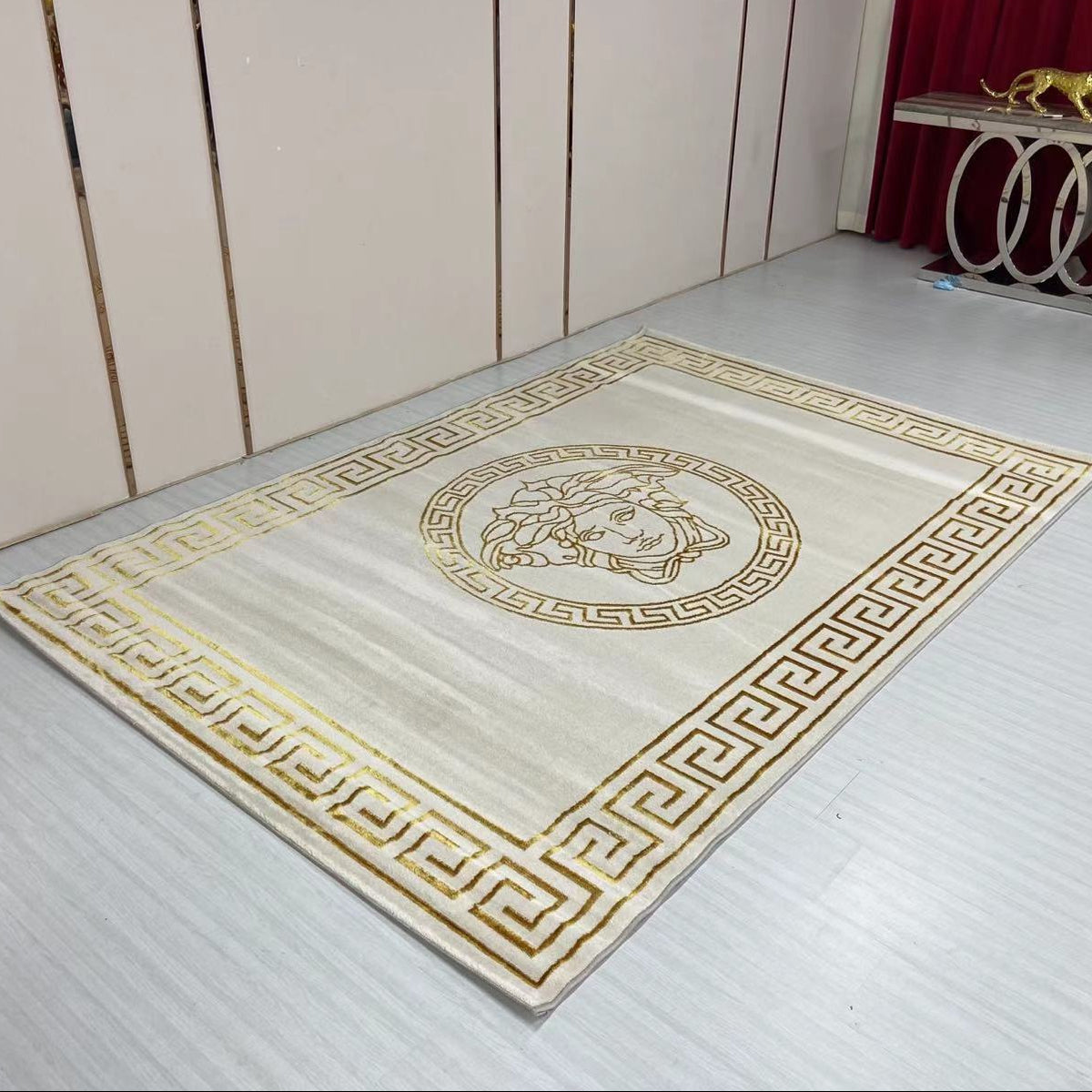 Decorative rug with geometric pattern on a wooden floor