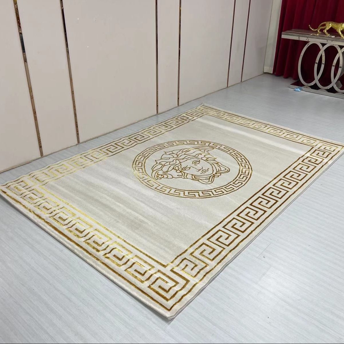 Decorative rug with geometric pattern on a wooden floor