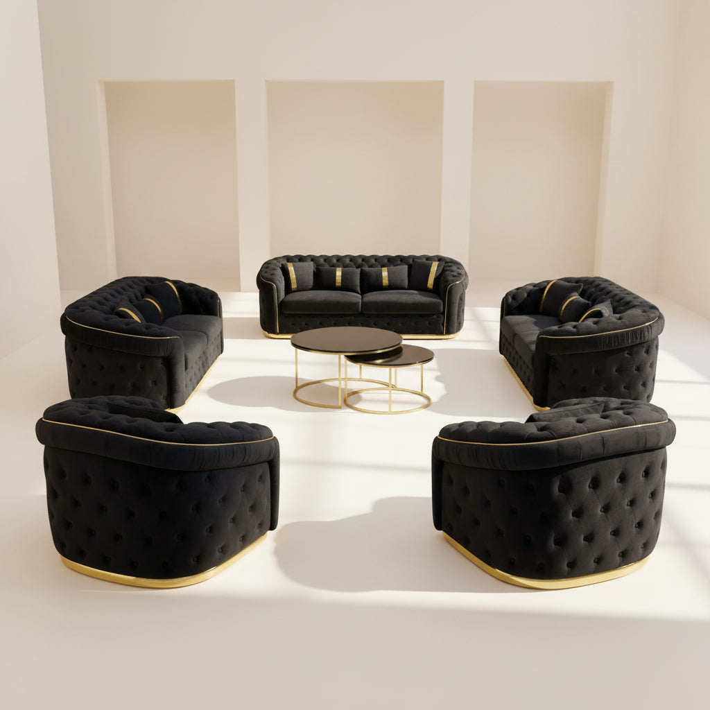 Black velvet sofa set with gold accents on a white floor.