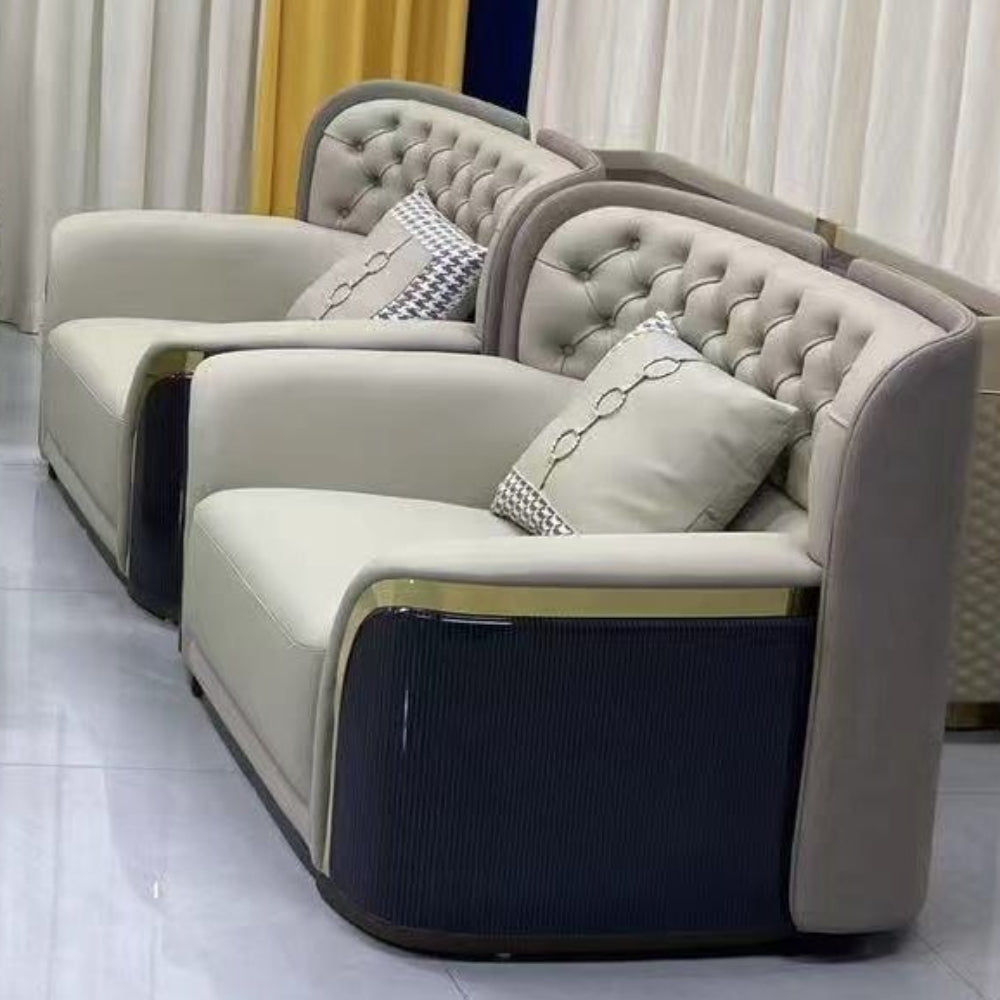 Modern living room setup with gray sofas and a coffee table in a room with striped walls.