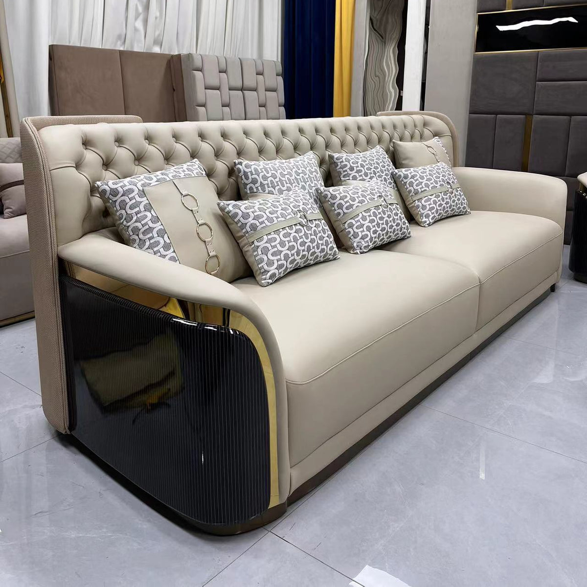 Beige sofa with patterned cushions in a modern living room setting