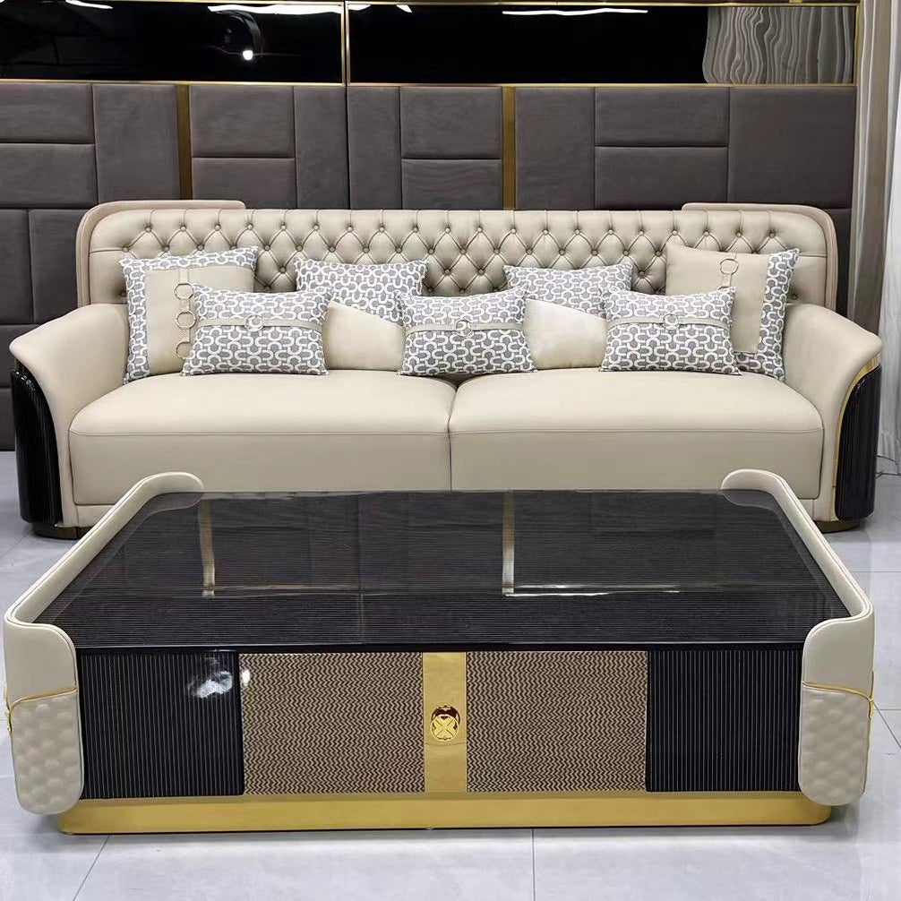 Luxury interior with a beige sofa, armchair, and side table against a gray tiled wall.