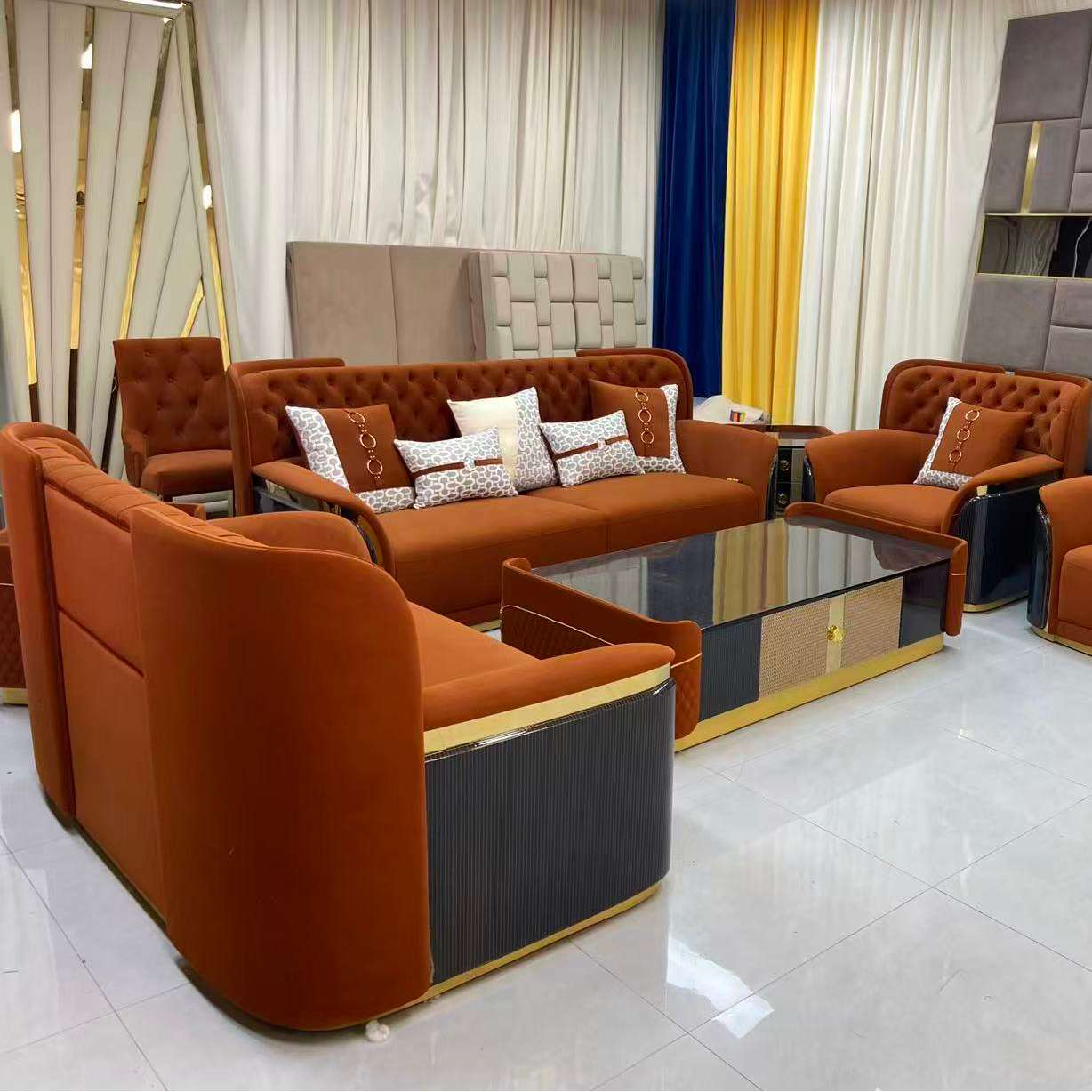 Modern living room setup with gray sofas and a glass coffee table.