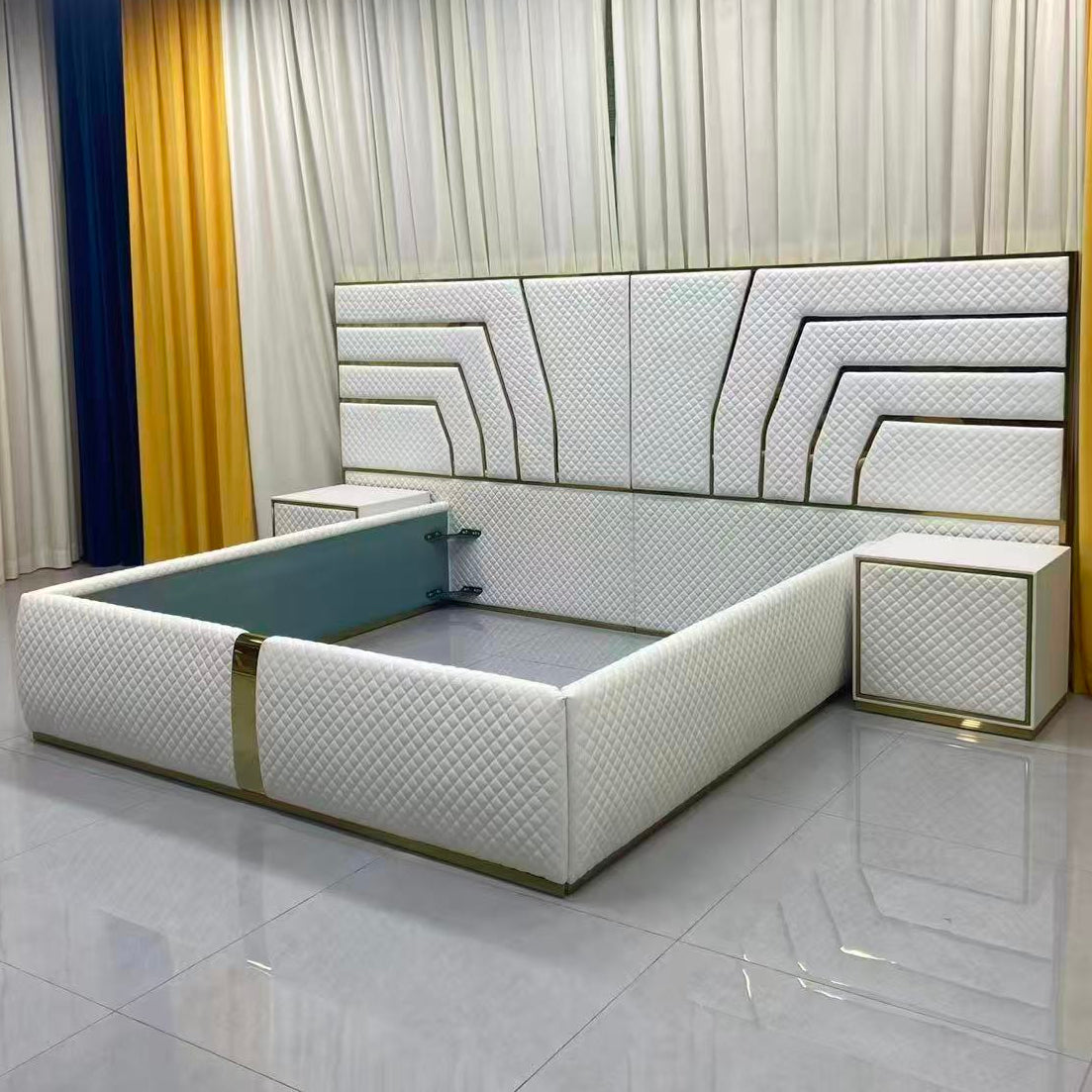 Modern bed with geometric headboard in a room with yellow curtains.