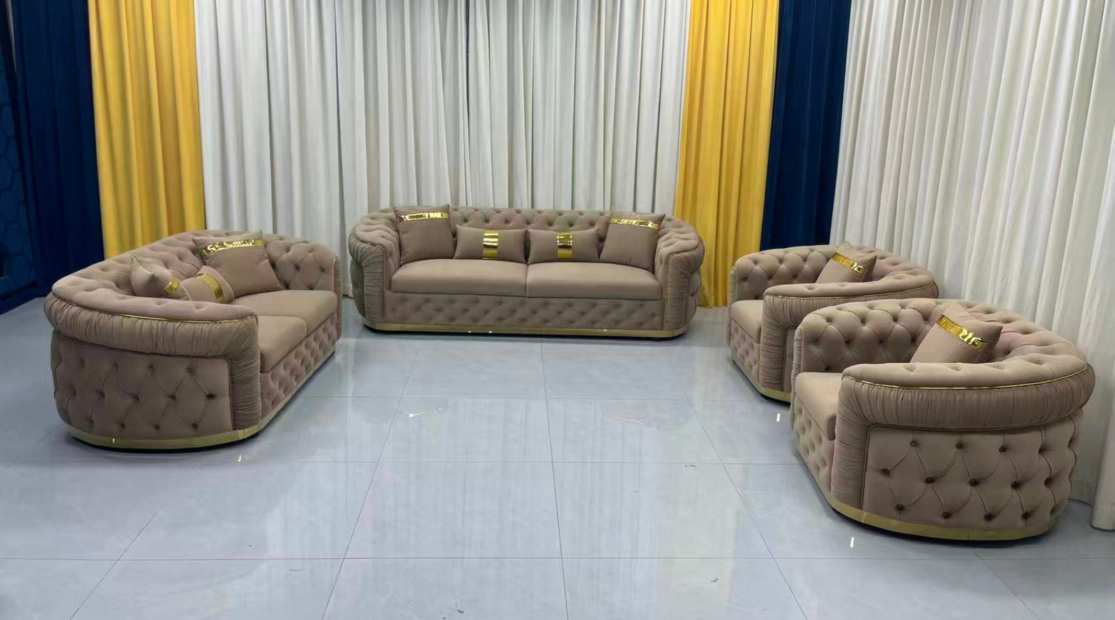 Brown sofa set in a showroom with yellow and blue curtains.