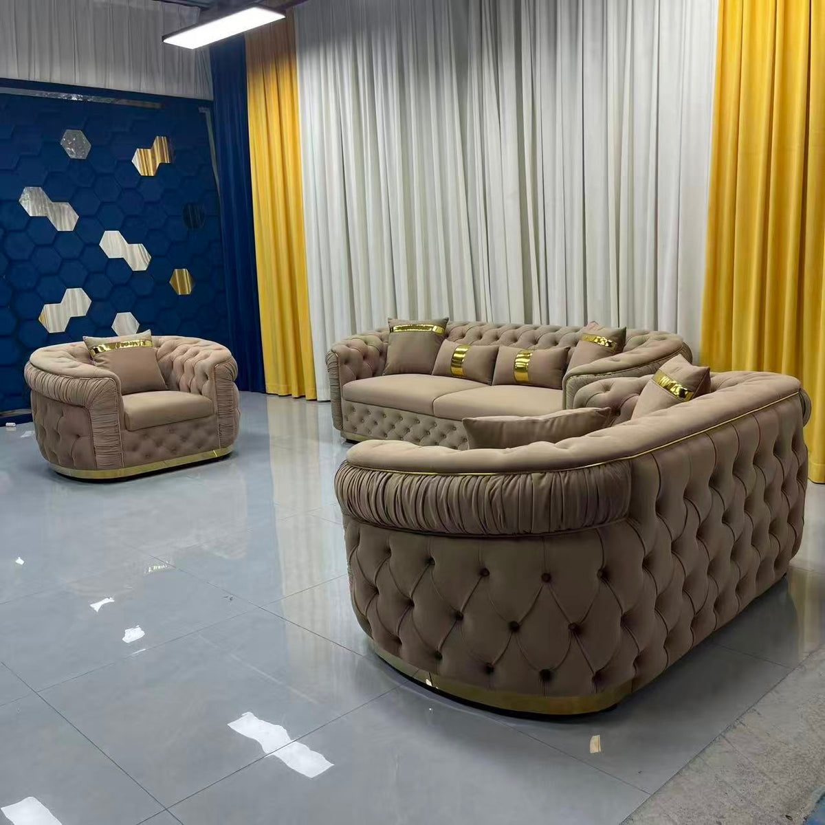 Luxury brown sofa set with tufted design in a modern room with yellow curtains.
