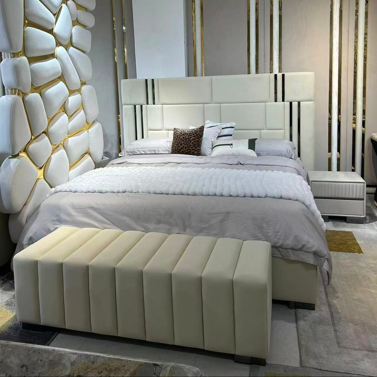 Modern bedroom with a stylish headboard and decorative wall.