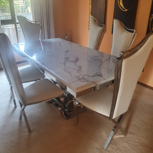 Classic Marble Dining Table with Classy White Leather Dining Room Chairs with Silver Stainless Steel Frame
