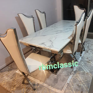 Classy Marble Dining table and 6 stainless steel Chairs