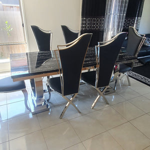 Classic Marble Dining Table With Black Leather Dining Room Chairs in Silver Stainless Steel Frame