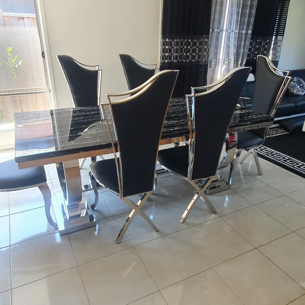 Classic Marble Dining Table With Classy Black Leather Dining Room Chairs in Silver Stainless Steel Frame