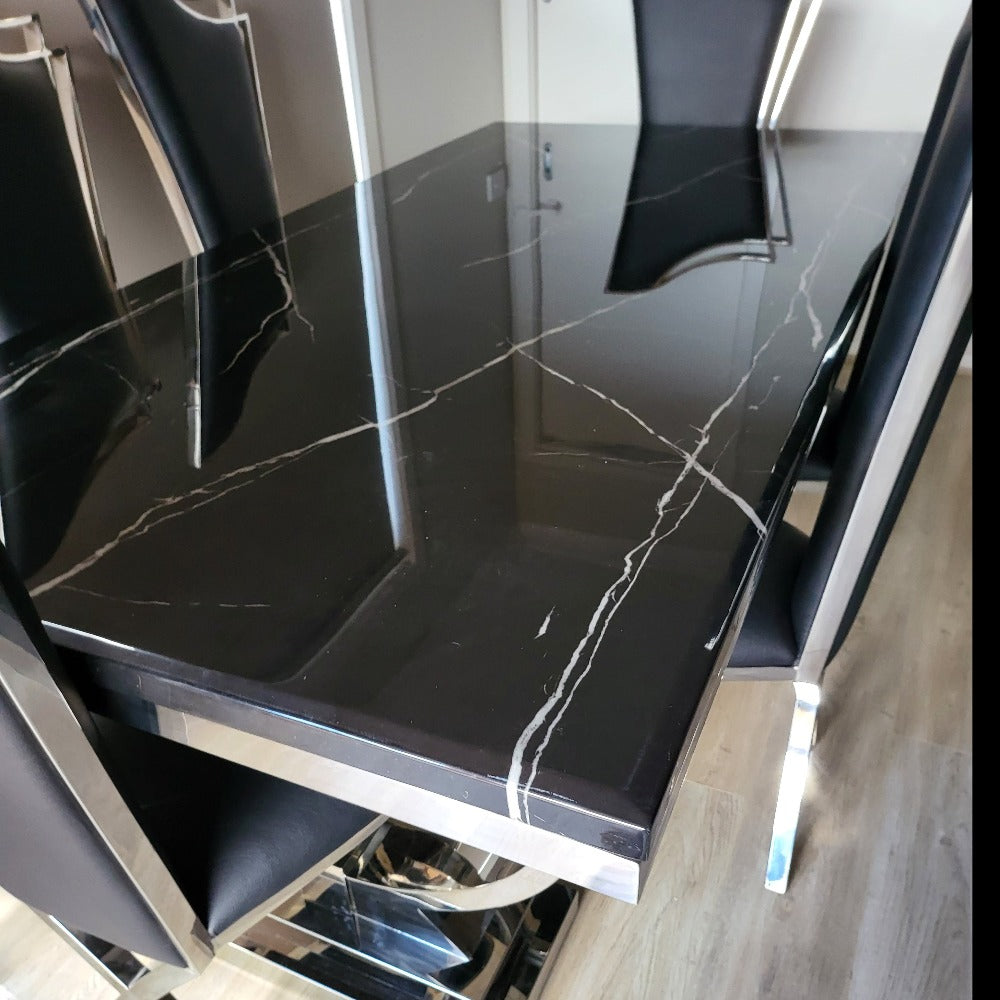 Classy Marble Dining Table With Classy Black Leather Dining Room Chairs in Silver Stainless Steel Frame
