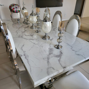 Classy Marble Dining Table With White Leather Dining Room Chairs in Silver Stainless Steel Frame