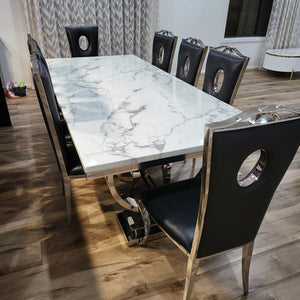 Classy Marble Dining Table With Black Leather Circle Dining Room Chairs in Silver Stainless Steel Frame