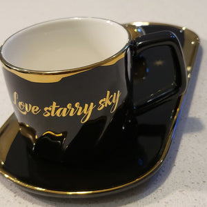 Golden Trim Modern Stars Style Tea Cup, a Saucer and Gold Spoon in Black