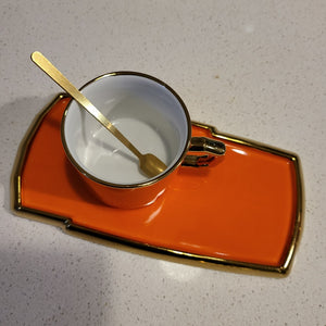 Golden Trim Modern Style Tea Cup, a Saucer and Gold Spoon in Orange